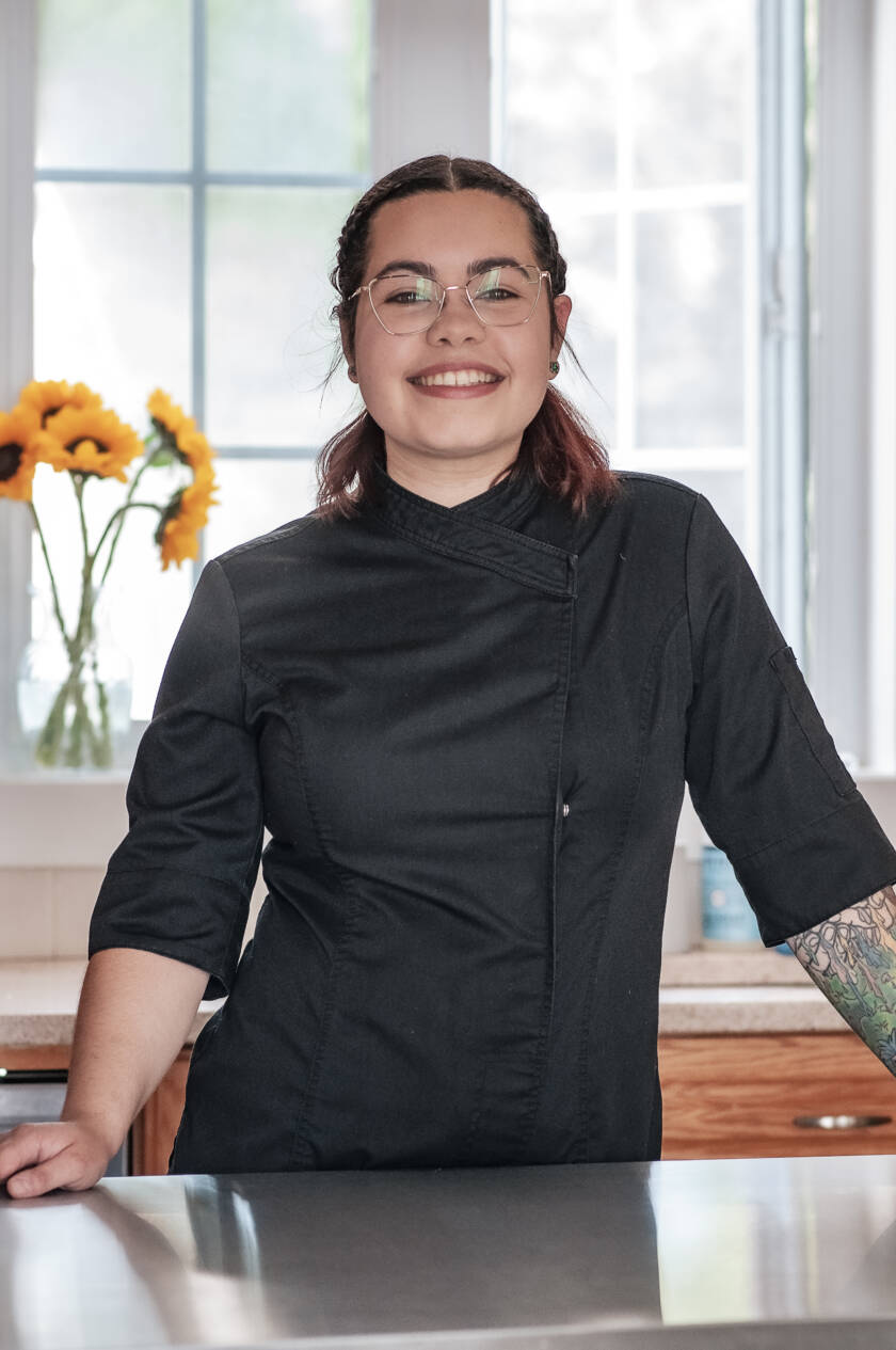 Alyssa, founder and head baker of Sugar Street Buns, in her chef coat